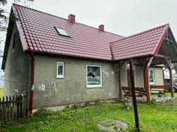 1/2 UDZIAŁU W NIERUCHOMOŚCI POŁOŻONEJ W MIEJSCOWOŚCI TUSZKOWY , GMINA LIPUSZ, POWIAT KOŚCIERSKI, NA DZIAŁKACH NR 182,237,239,432,234,238,354,233/5,233/6,245/1 i 245/2